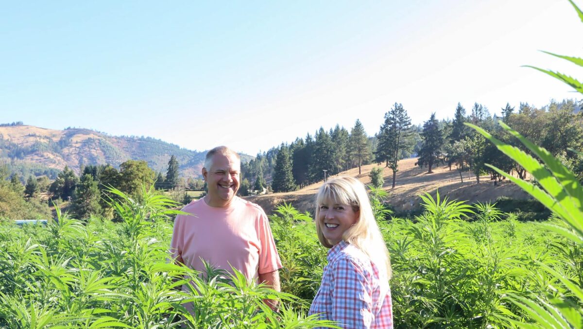 Clint and Danette Thompson in the God's Glory Hemp Fields